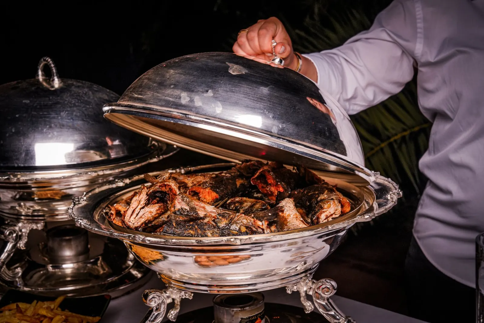Chef serving from the chafing dish